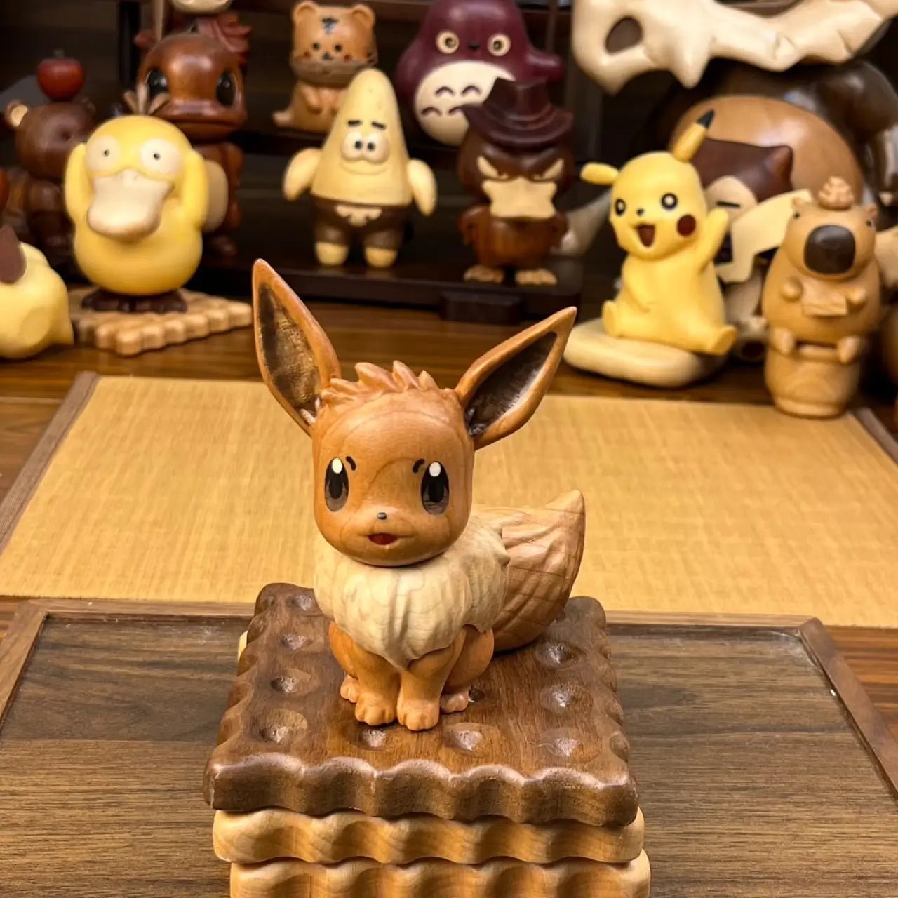 Front view of handcrafted wooden Eevee figurine, natural wood colors, perfect for collection and display