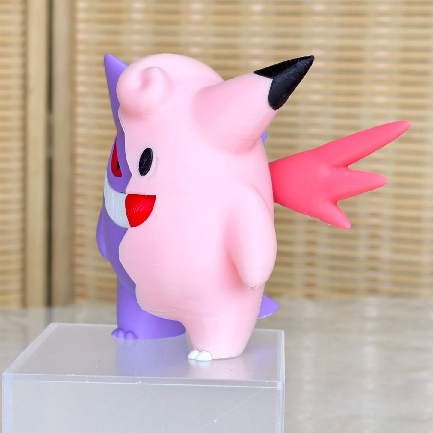 Side angle of Gengar and Clefable fusion figure with magnetic half design, Pokémon handmade collectible