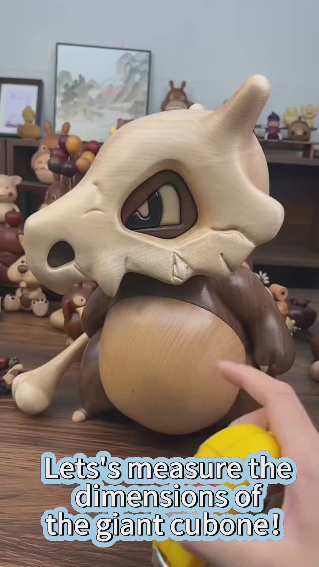 Pokémon merchandise Cubone wood - carved figure, displayed in various scenes, reference for collectors.